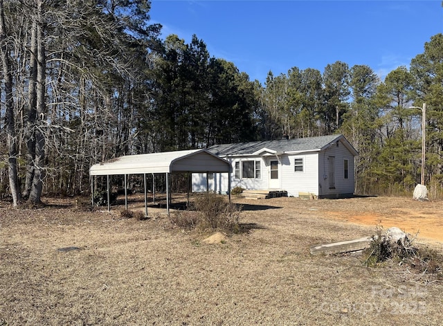 view of front of home featuring a carport