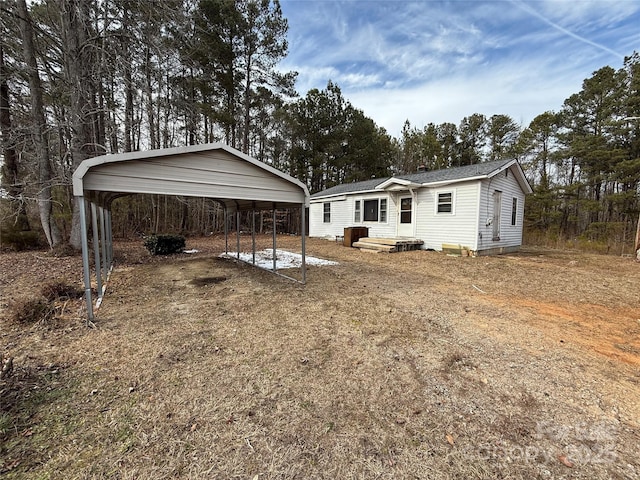 exterior space featuring a carport