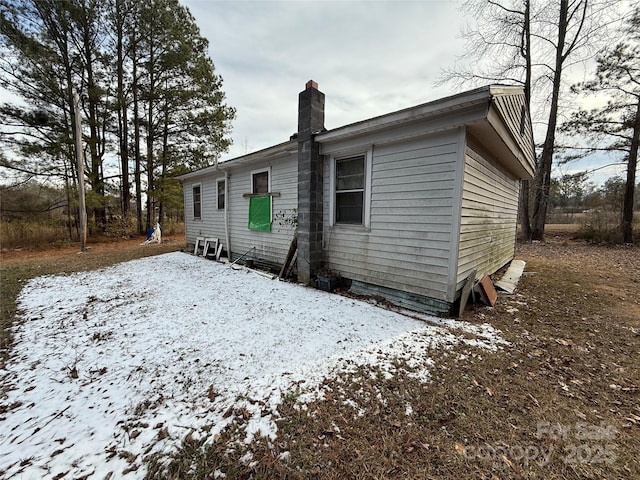 view of snow covered house