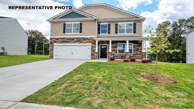 craftsman-style home with a garage, a front yard, and central AC unit