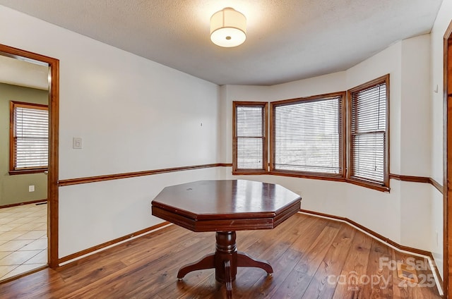 unfurnished dining area featuring hardwood / wood-style floors