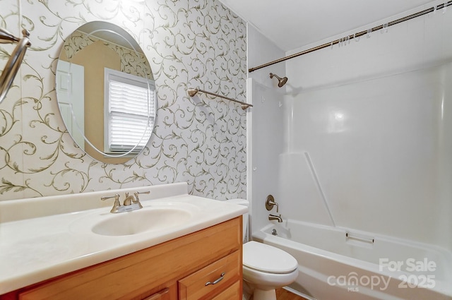 full bathroom with toilet, vanity, and shower / bathing tub combination