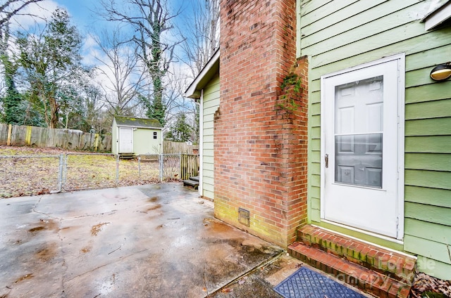 view of patio featuring a storage shed