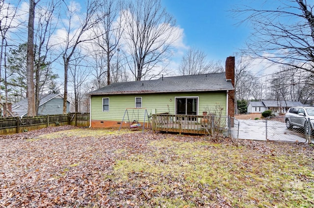 rear view of property with a deck