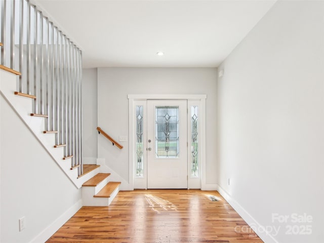 entryway with light hardwood / wood-style floors