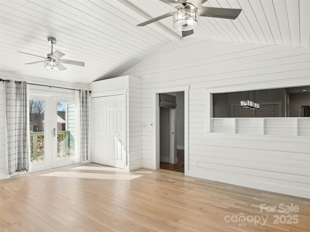 interior space with light wood-type flooring, ceiling fan, and lofted ceiling with beams