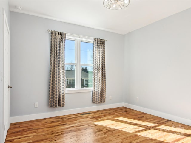 spare room featuring hardwood / wood-style flooring