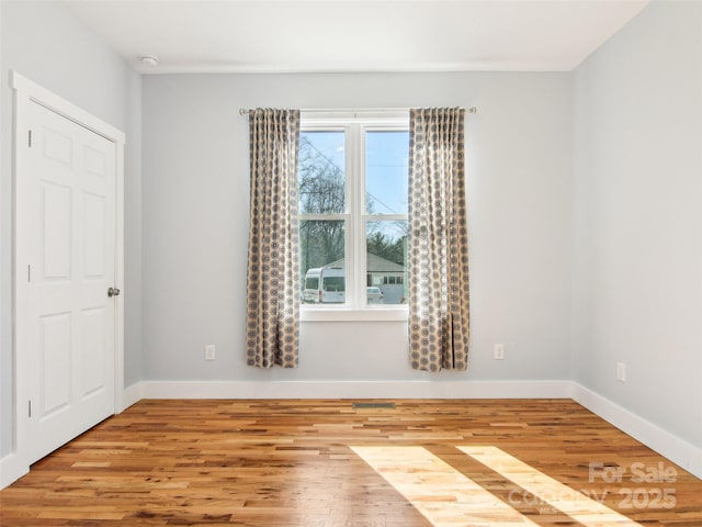 unfurnished room featuring light hardwood / wood-style floors