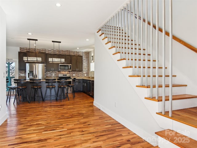 staircase featuring hardwood / wood-style floors