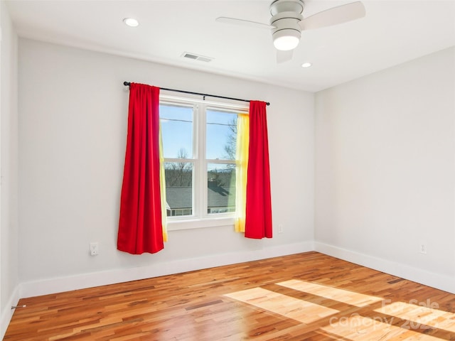 empty room featuring ceiling fan and wood-type flooring