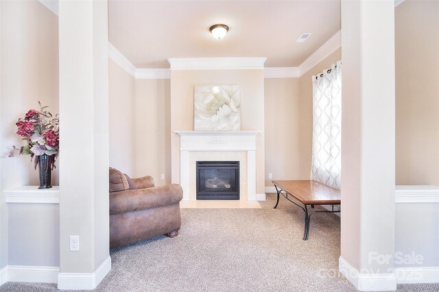 living area with baseboards, carpet, a fireplace with flush hearth, and crown molding