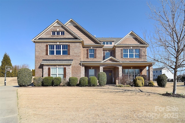 view of front of property featuring brick siding