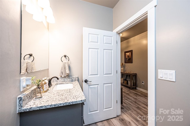 bathroom with vanity and hardwood / wood-style floors