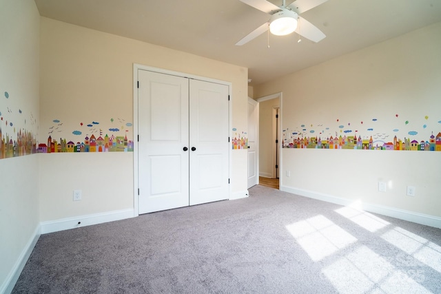 unfurnished bedroom featuring a closet, carpet floors, and ceiling fan