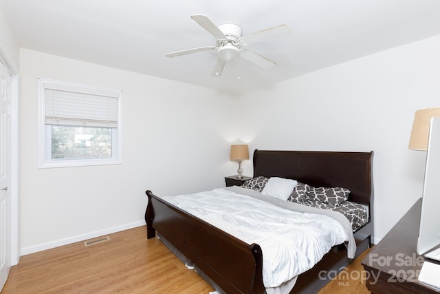 bedroom featuring hardwood / wood-style flooring and ceiling fan