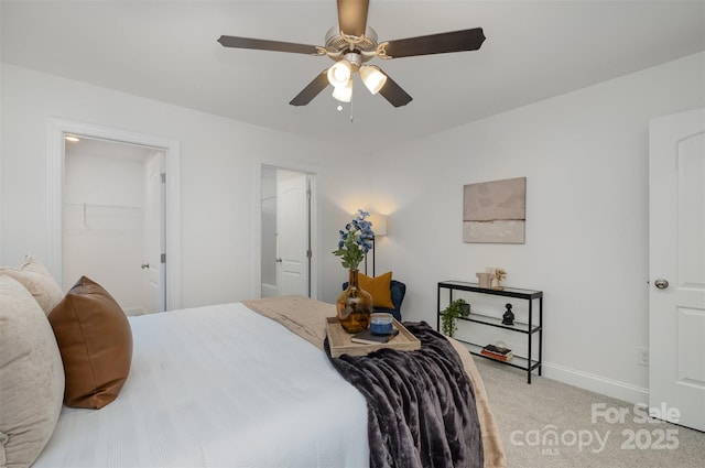 carpeted bedroom featuring a closet and ceiling fan