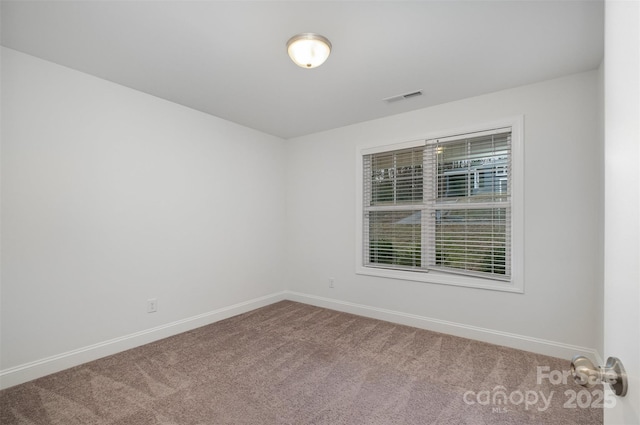 empty room with carpet flooring