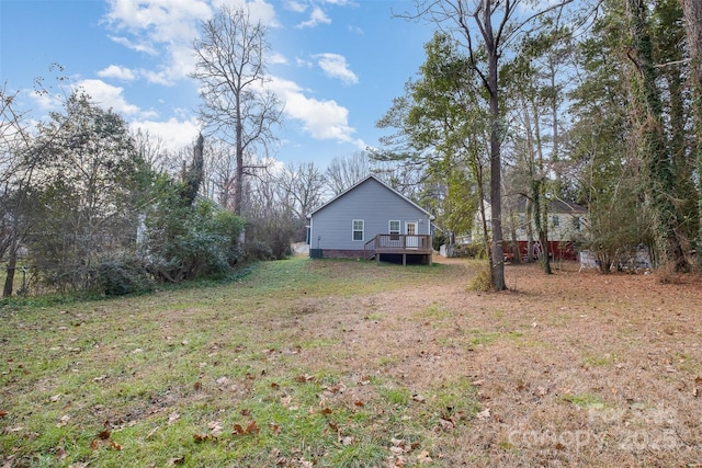 view of yard featuring a wooden deck