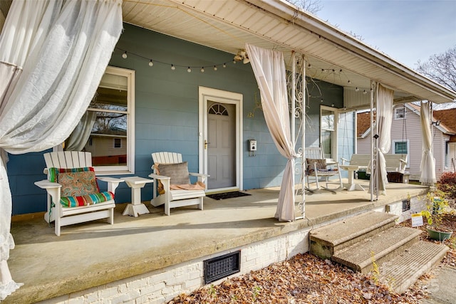 property entrance featuring covered porch