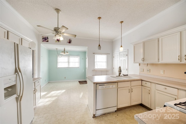 kitchen with sink, crown molding, hanging light fixtures, kitchen peninsula, and white appliances