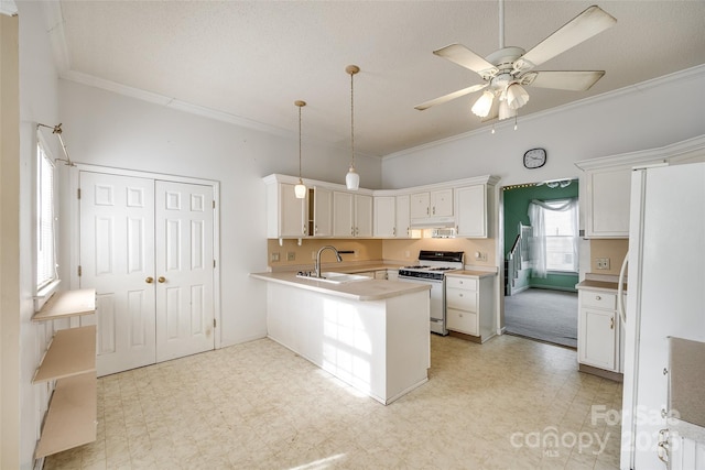 kitchen featuring white cabinetry, ornamental molding, kitchen peninsula, pendant lighting, and white appliances