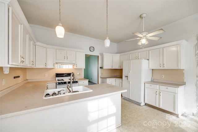 kitchen featuring white cabinets, white appliances, and decorative light fixtures