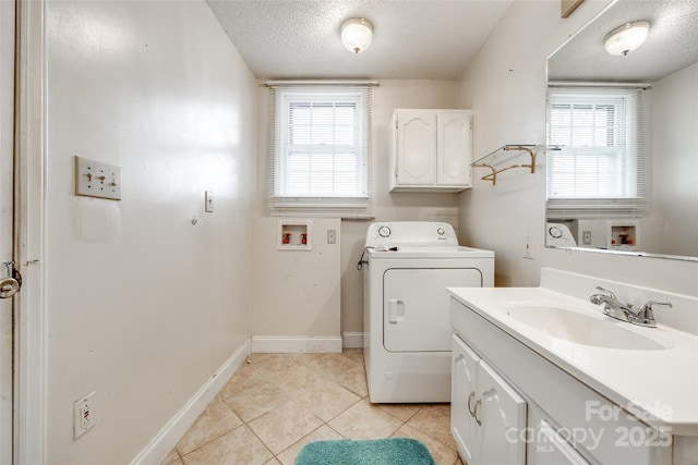 laundry room featuring washer / clothes dryer, light tile patterned floors, sink, and a textured ceiling