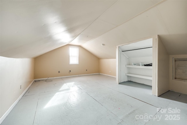 additional living space featuring vaulted ceiling