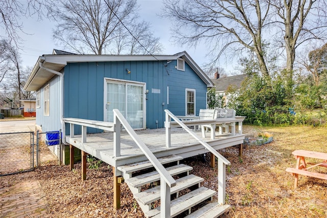 back of house featuring a deck