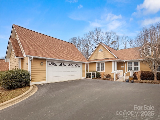 view of front of home with a garage