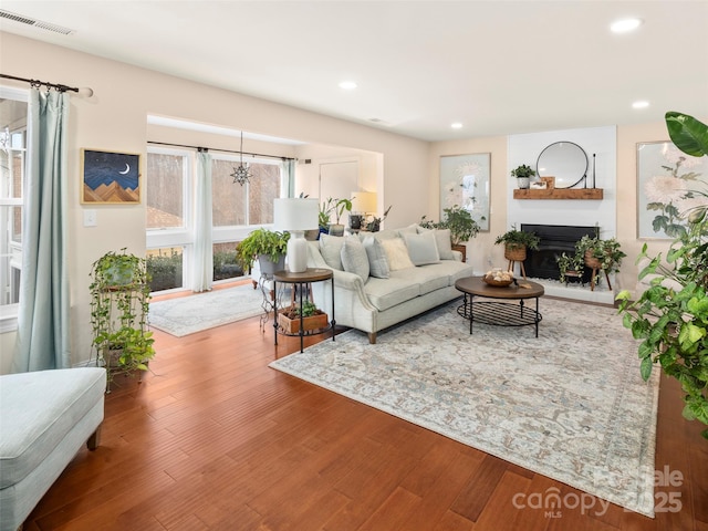 living room featuring hardwood / wood-style flooring and a wealth of natural light