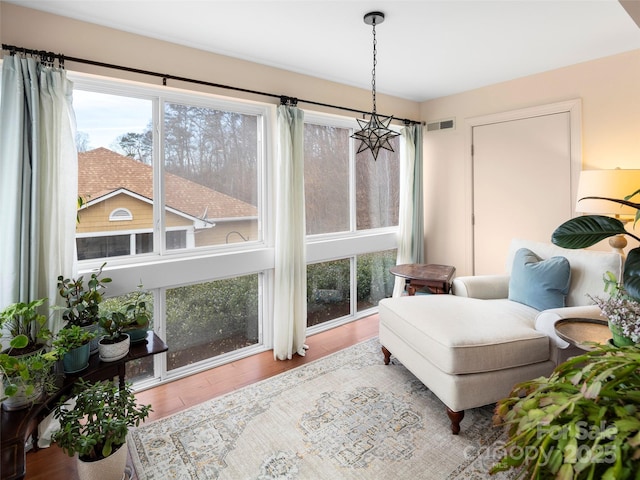 sitting room with hardwood / wood-style flooring