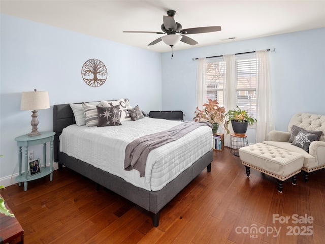 bedroom featuring dark hardwood / wood-style floors and ceiling fan