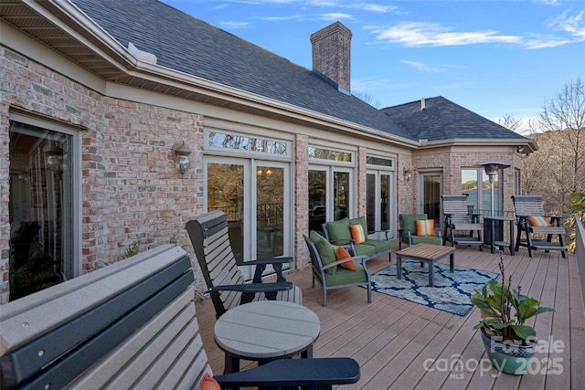 deck with an outdoor hangout area