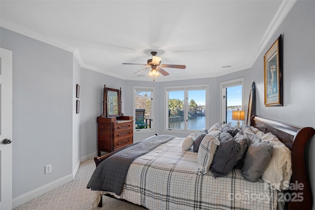 carpeted bedroom featuring ornamental molding, ceiling fan, and a water view