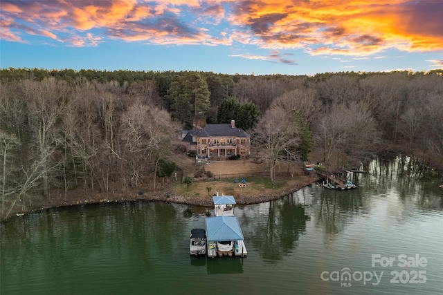 aerial view at dusk with a water view