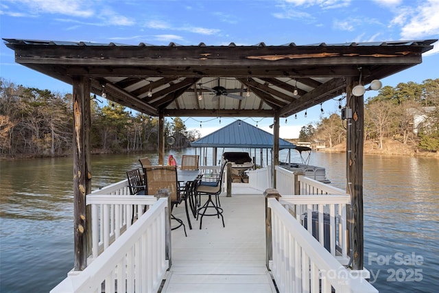 dock area featuring a gazebo and a water view