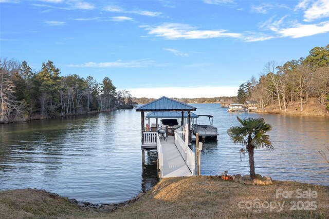 dock area with a water view and a gazebo