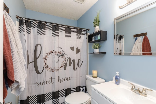 bathroom with vanity, toilet, a textured ceiling, and a shower with shower curtain