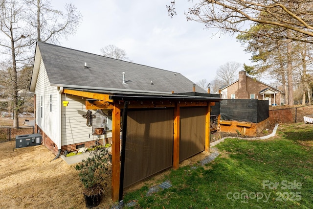 rear view of house with a lawn