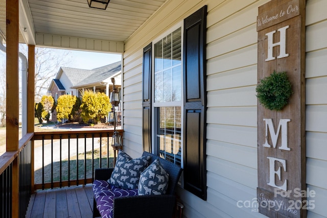 wooden deck featuring covered porch