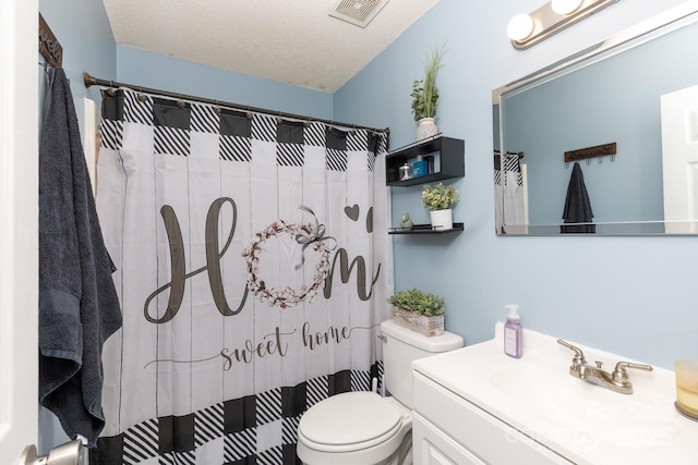 full bath featuring visible vents, toilet, a shower with curtain, a textured ceiling, and vanity