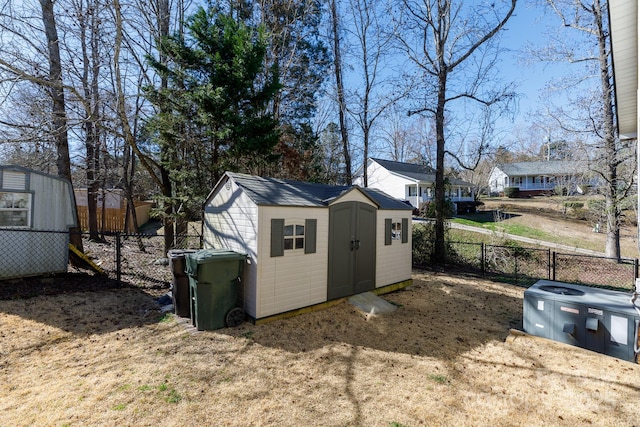 view of shed with a fenced backyard