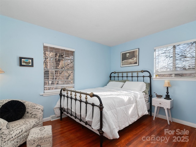 bedroom featuring dark wood-type flooring