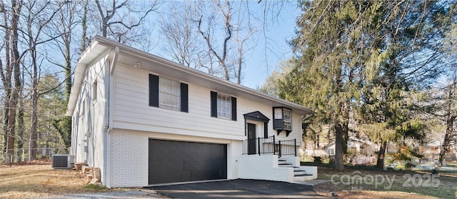 raised ranch with central AC and a garage