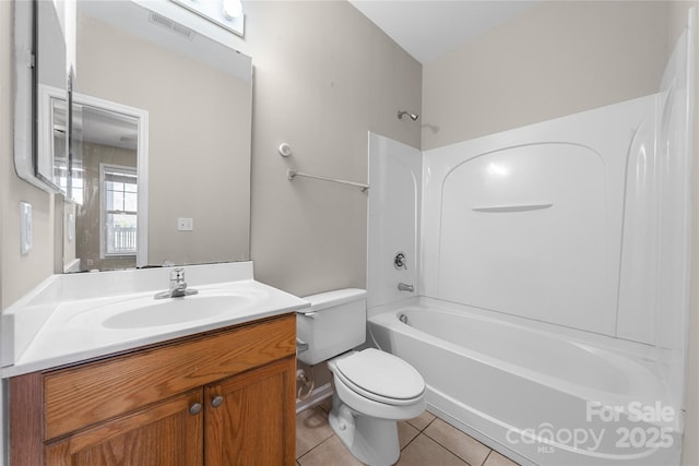 full bathroom featuring tile patterned floors, toilet, vanity, and shower / bathtub combination