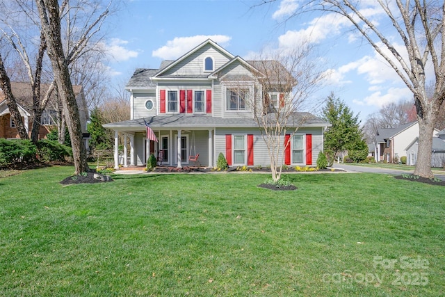 view of front facade featuring a porch and a front yard