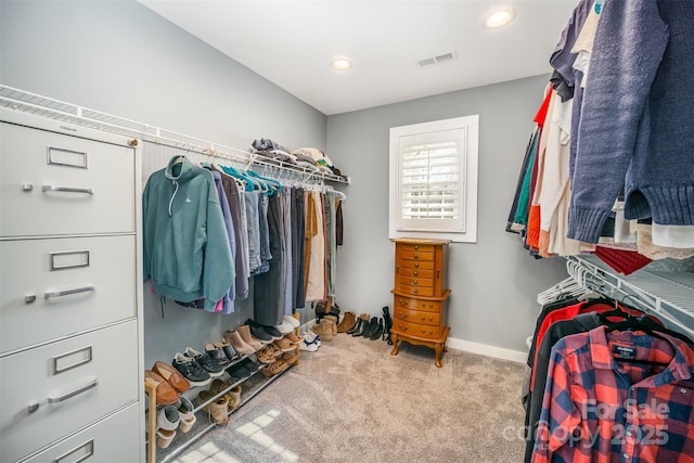 spacious closet with carpet floors and visible vents