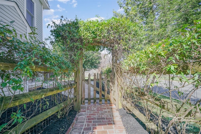 view of patio / terrace featuring fence and a gate