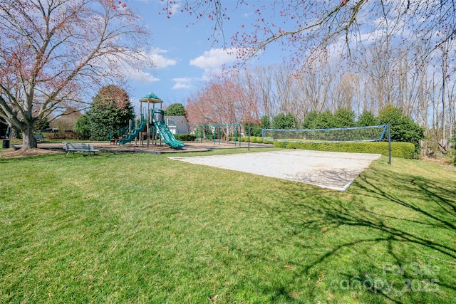 community jungle gym with a yard and volleyball court